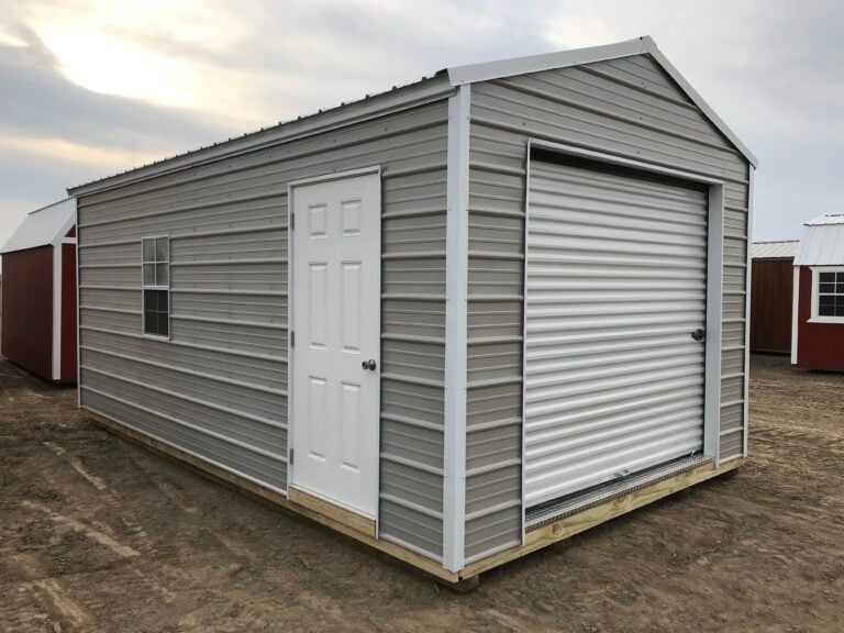 Grey metal Burnett portable garage with a roll-up door