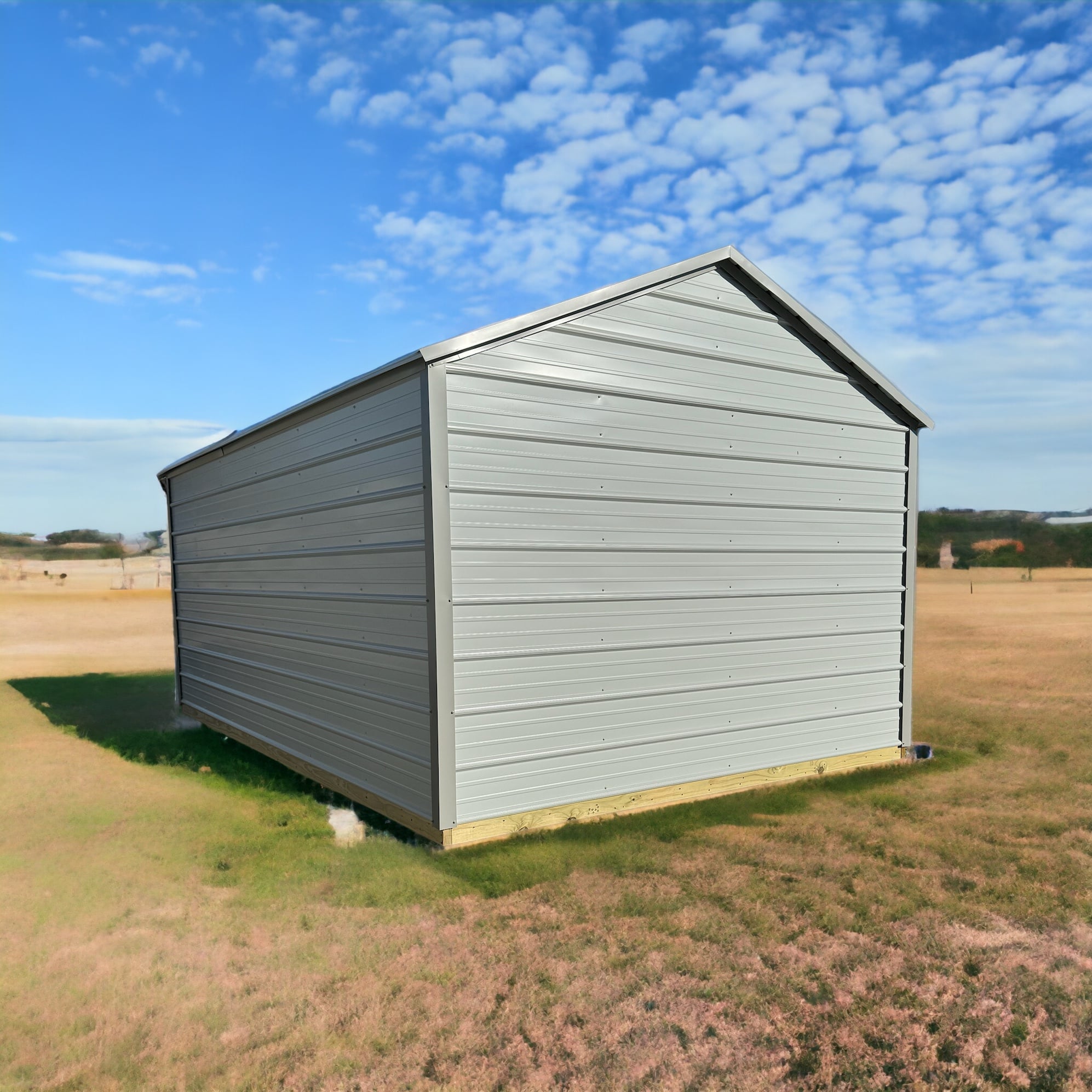 Metal Value Shed in a mowed field, showing the painted metal siding and galvanized roof