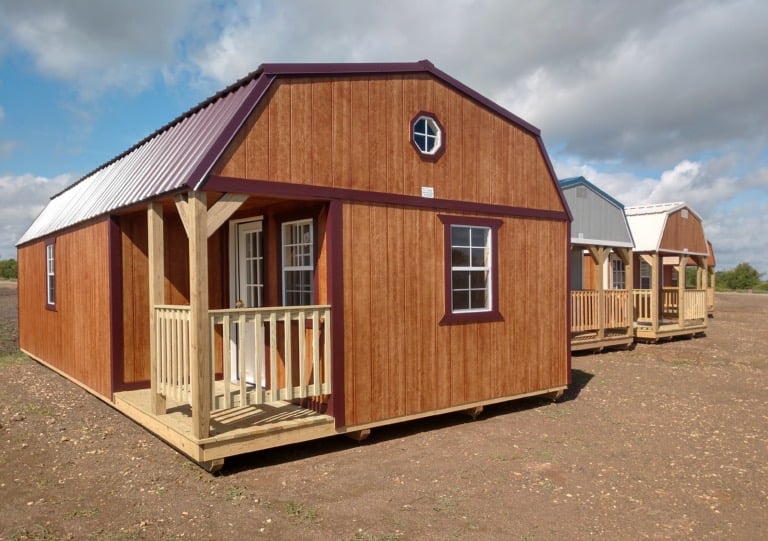 Row of Burnett mini barns on a dealer lot in Oklahoma